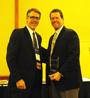 Mark Tettemer, right, is presented the WateRuse Association's President's Award, by former IRWD General Manager Paul Jones, who is the outgoing president of the association